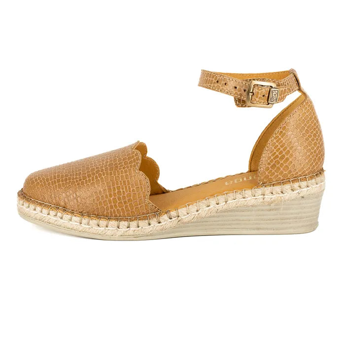 Tan wedge sandal with espadrille sole on a white background