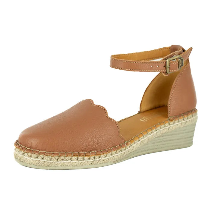 Brown wedge sandal with espadrille sole on a white background