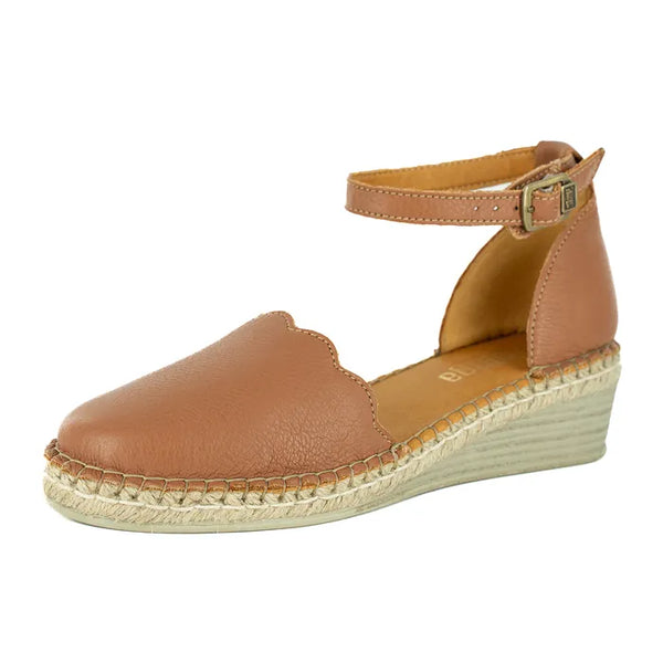 Brown wedge sandal with espadrille sole on a white background