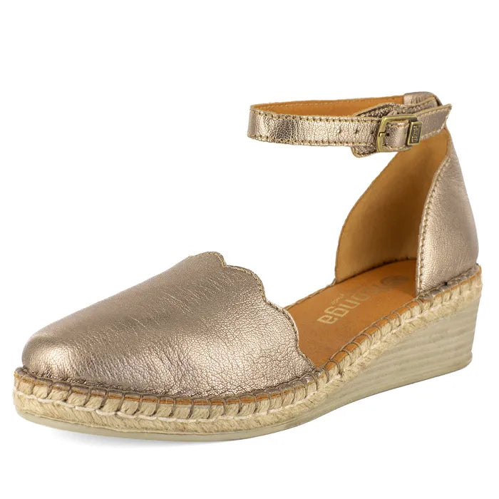 Gold espadrille wedge sandal on a white background