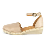 Beige wedge sandal with scalloped edge on a white background