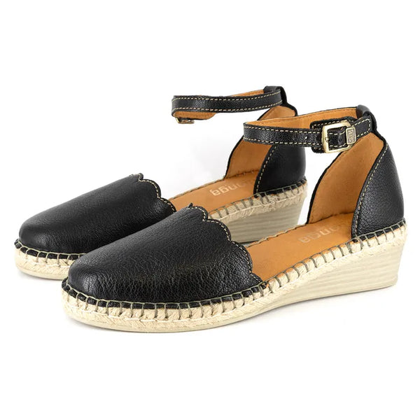 Black espadrille wedge sandals on a white background