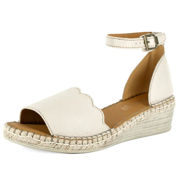Cream wedge sandal with off-white sole on a white background