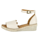 Cream wedge sandal with off-white sole on a white background