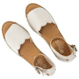 Cream wedge sandal with off-white sole on a white background