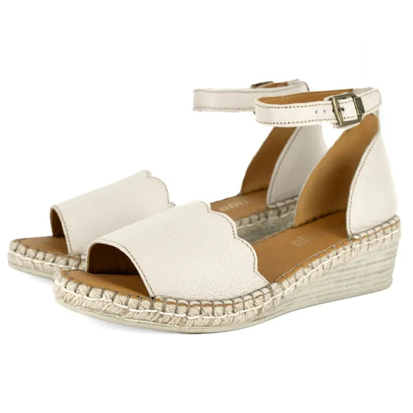 Cream wedge sandal with off-white sole on a white background