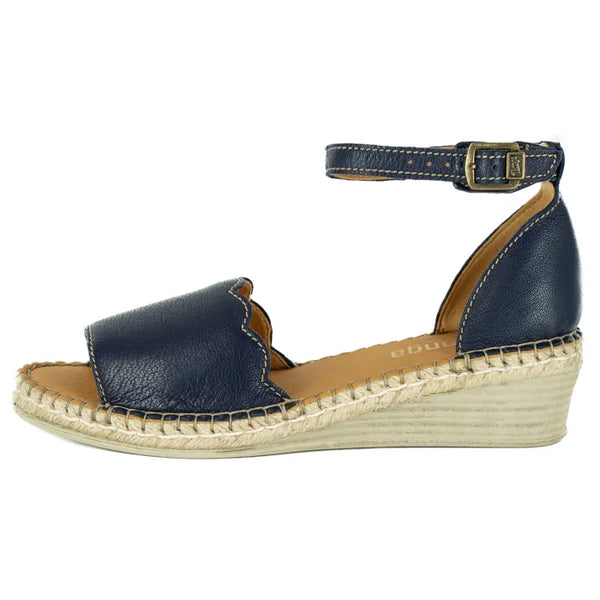 Navy blue wedge sandal with espadrille sole on a white background