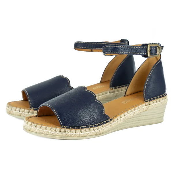 Navy blue sandals with espadrille sole on a white background