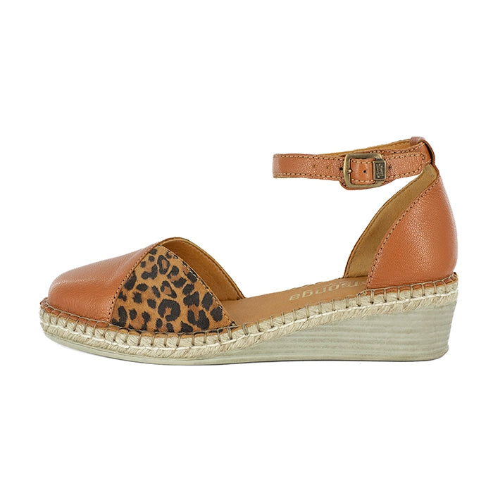 Brown wedge sandal with leopard print heel on a white background