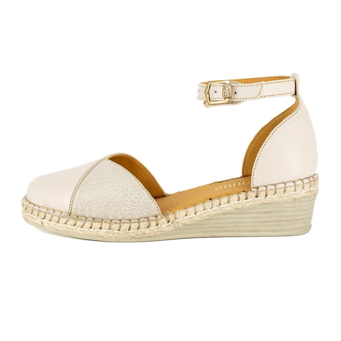Beige wedge sandal with espadrille sole on a white background