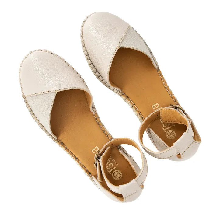 Pair of beige espadrille sandals on a white background