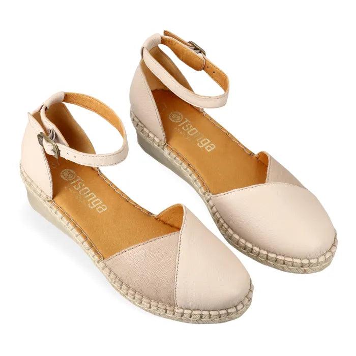 Beige wedge sandal with espadrille sole on a white background