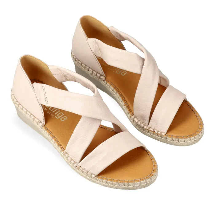 Beige wedge sandals with espadrille sole on a white background