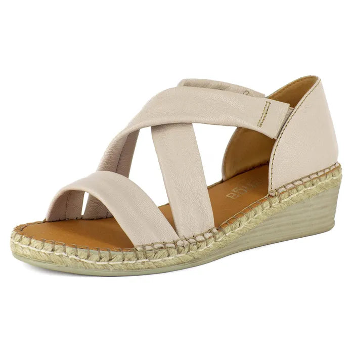 Beige wedge sandal with espadrille sole on a white background