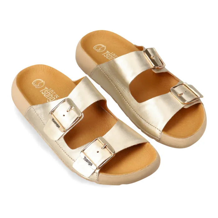 A pair of metallic gold double-strap slide sandals with gold-tone buckles and a tan footbed, shown on a plain white background.