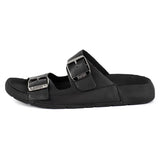 Black sandal with silver buckles on a white background
