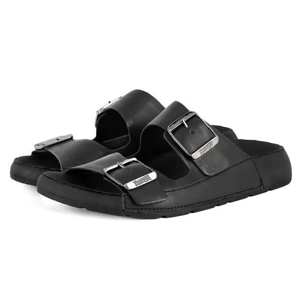 Black sandals with silver buckles on a white background