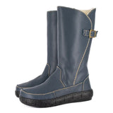 Pair of blue boots with a buckle on a white background