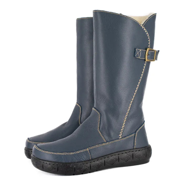 Pair of blue boots with a buckle on a white background