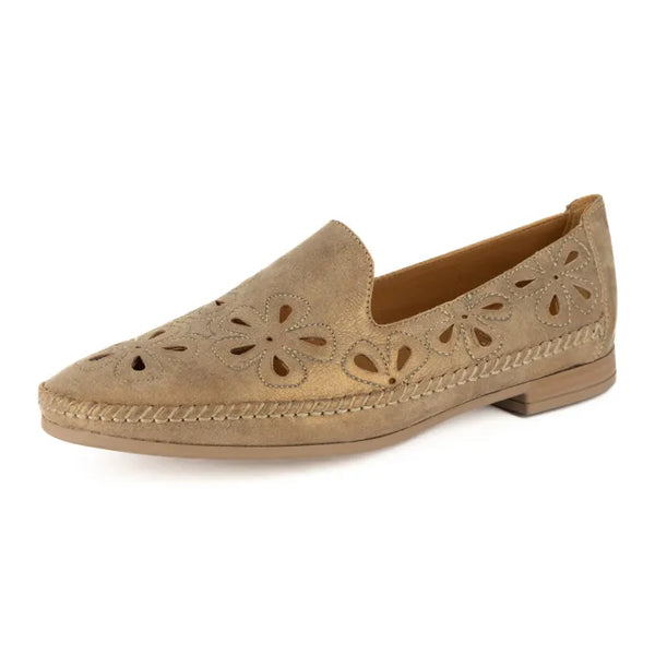 Beige loafer with floral cutouts on a white background