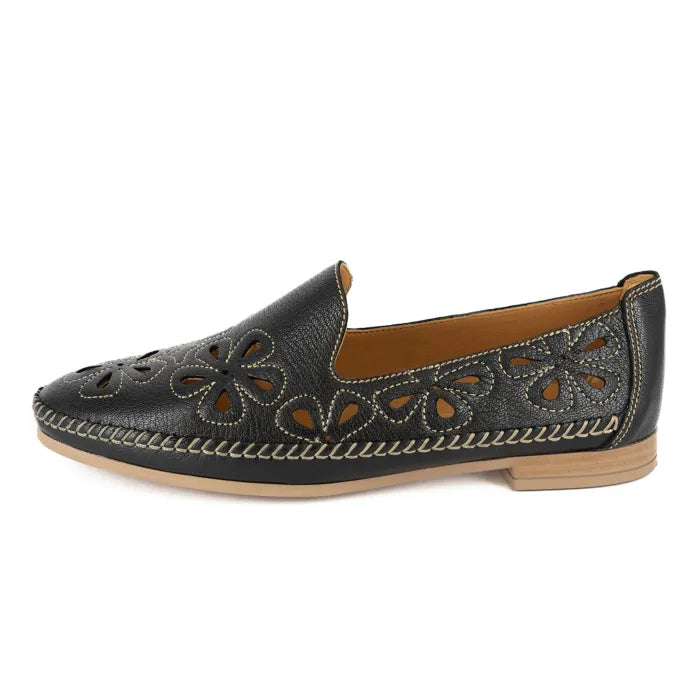 Black loafer shoe with floral cut-out design on a white background