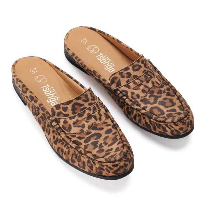 Pair of leopard print loafers on a white background