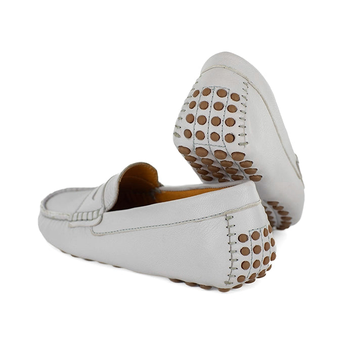 Light gray loafers with a polka dot sole on a white background
