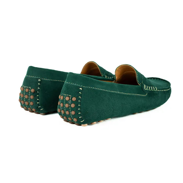 Pair of green loafers with brown studs on a white background