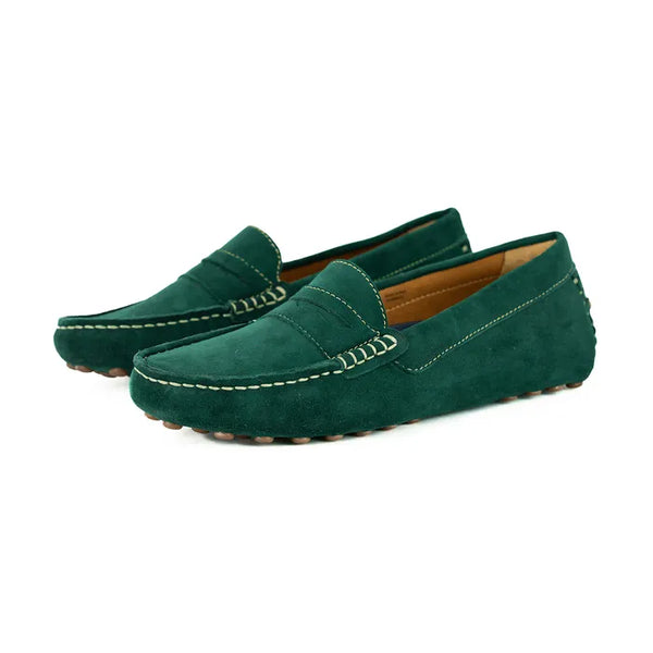 Pair of green loafers on a white background