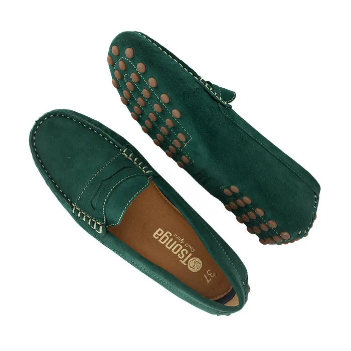 Green loafers with brown sole on a white background