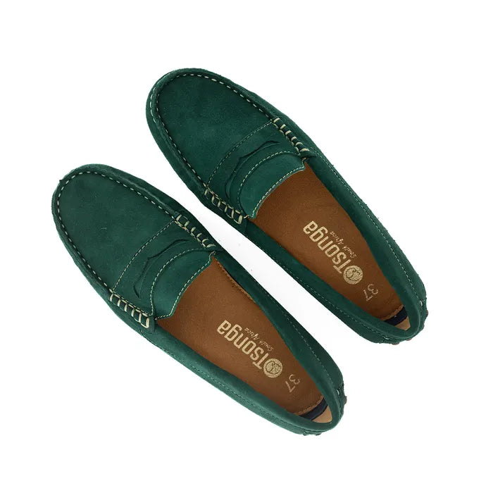 Pair of green loafers on a white background