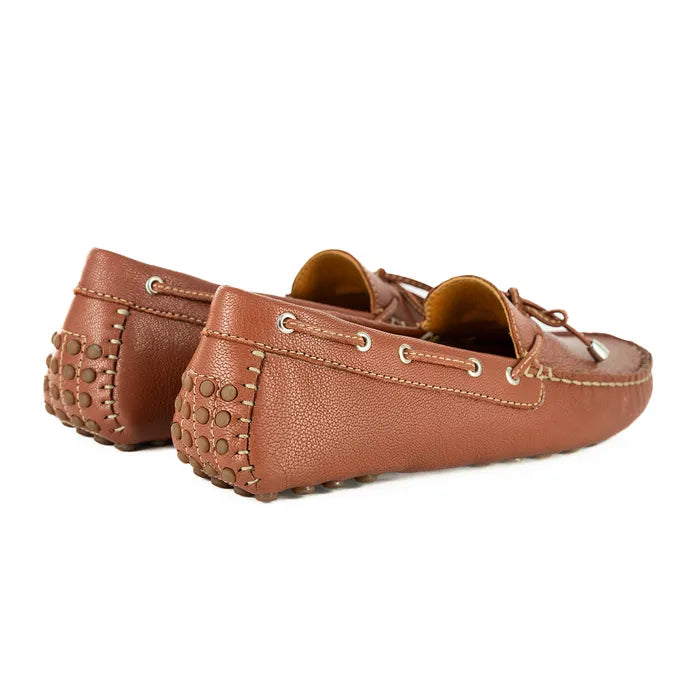 Pair of brown leather loafers on a white background