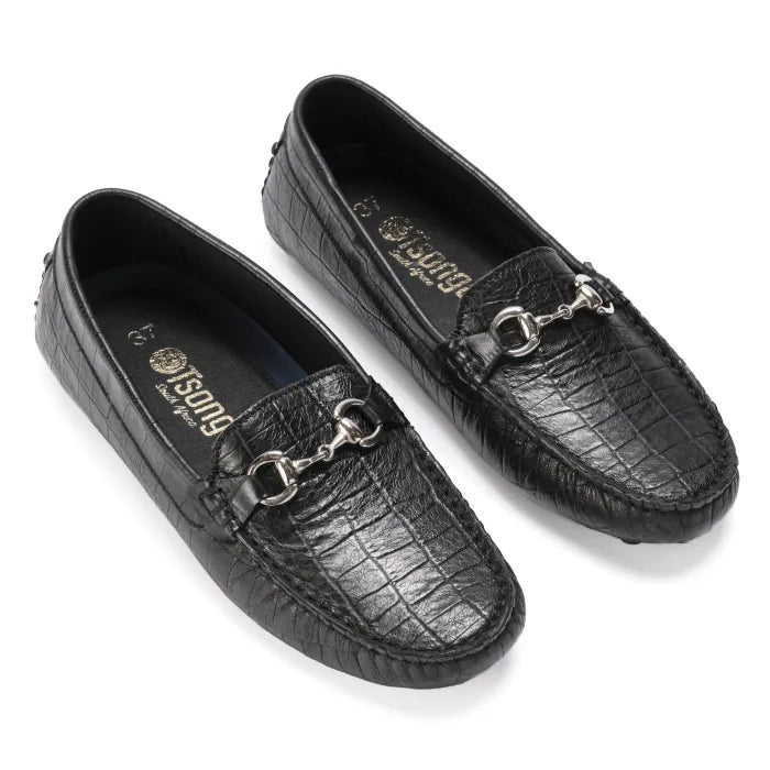 Black leather loafers with metallic accents on a white background