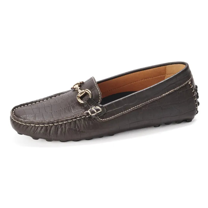 Brown loafer shoe with decorative buckle on a white background