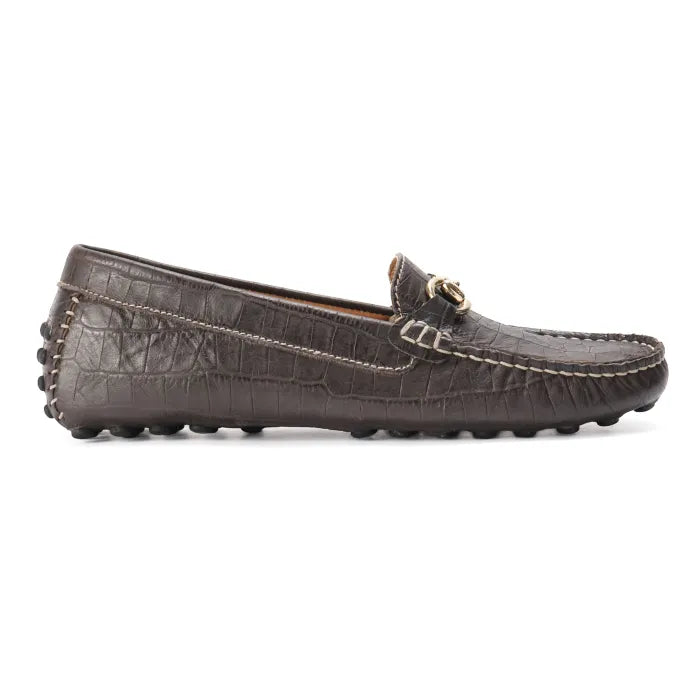 Brown leather loafer with decorative stud details on a white background