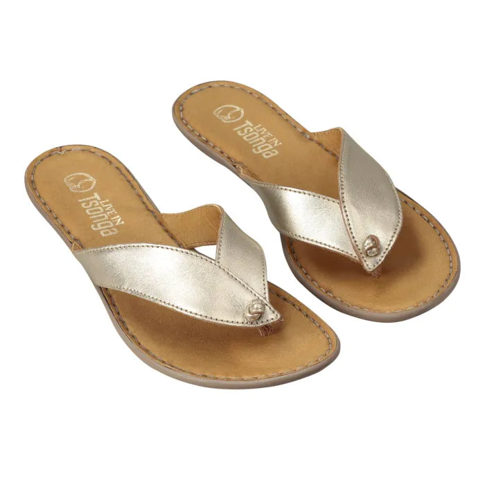 A pair of metallic gold thong sandals with tan footbeds and silver-tone rivets, shown on a plain white background.