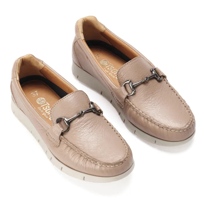 Pair of beige loafers with a metallic buckle on a white background