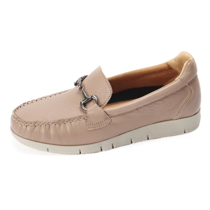 Beige loafer shoe with a decorative buckle on a white background