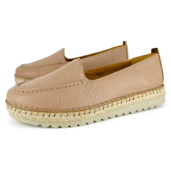 Pair of beige espadrille shoes on a white background