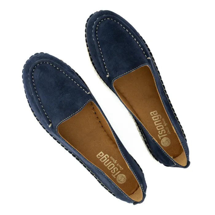 Pair of navy blue loafers with brown soles on a white background
