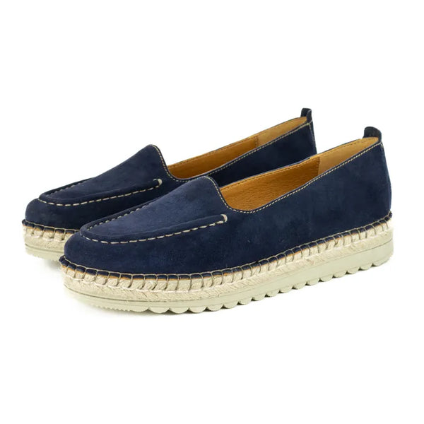 Pair of navy blue espadrille shoes on a white background