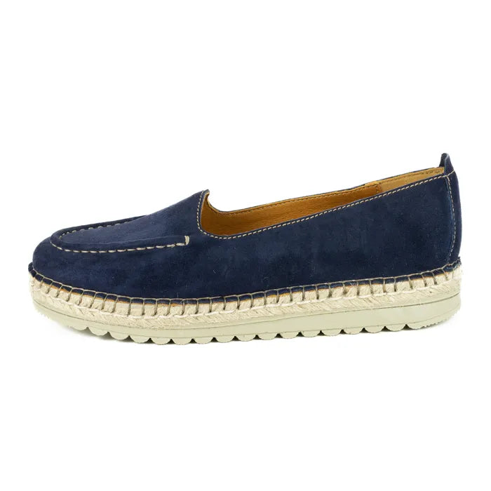 Navy blue espadrille shoe with a white sole on a white background