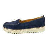 Navy blue espadrille shoe with a white sole on a white background