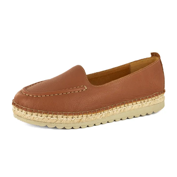 Brown loafer with a textured sole on a white background