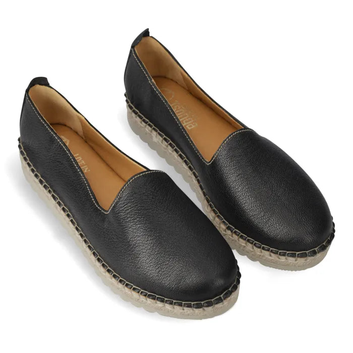Pair of black espadrilles with jute sole on a white background