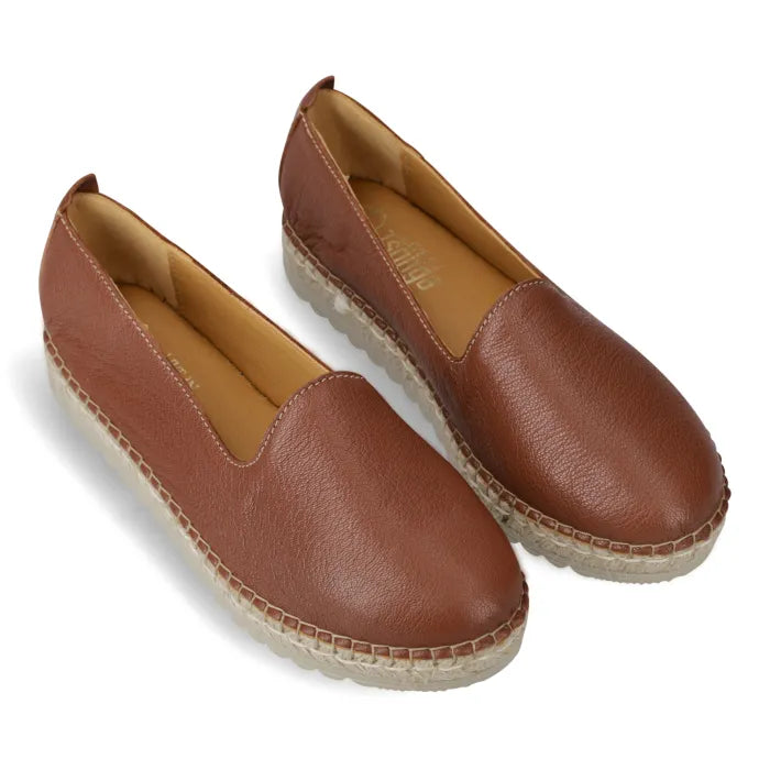 Pair of brown leather espadrilles on a white background