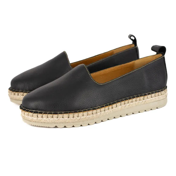 Black espadrille shoes with beige sole on a white background