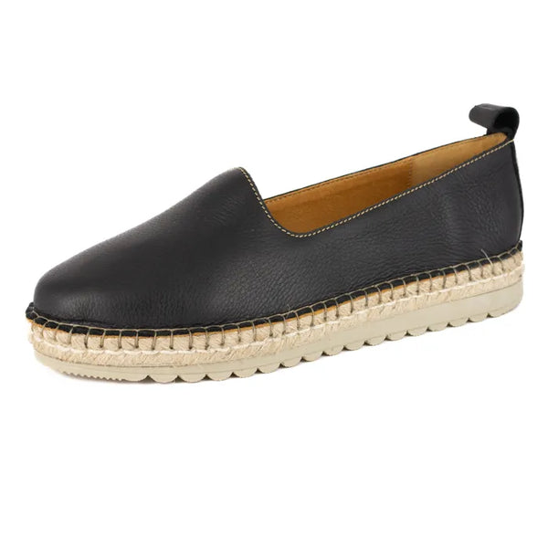 Black leather espadrille shoe on a white background