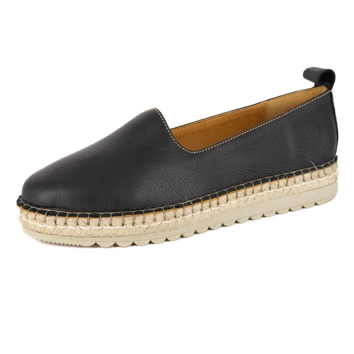 Black leather espadrille shoe on a white background