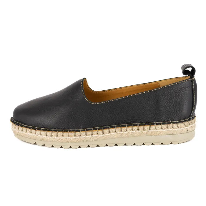 Black espadrille shoe with a beige sole on a white background
